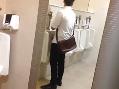 Caught man jerking at the urinals