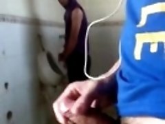 Asian guy jerks off in public toilet to attract attention